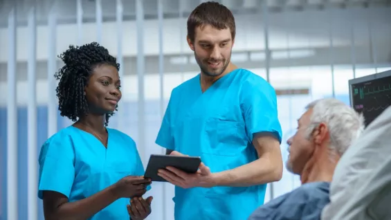 Nurses talking to a patient